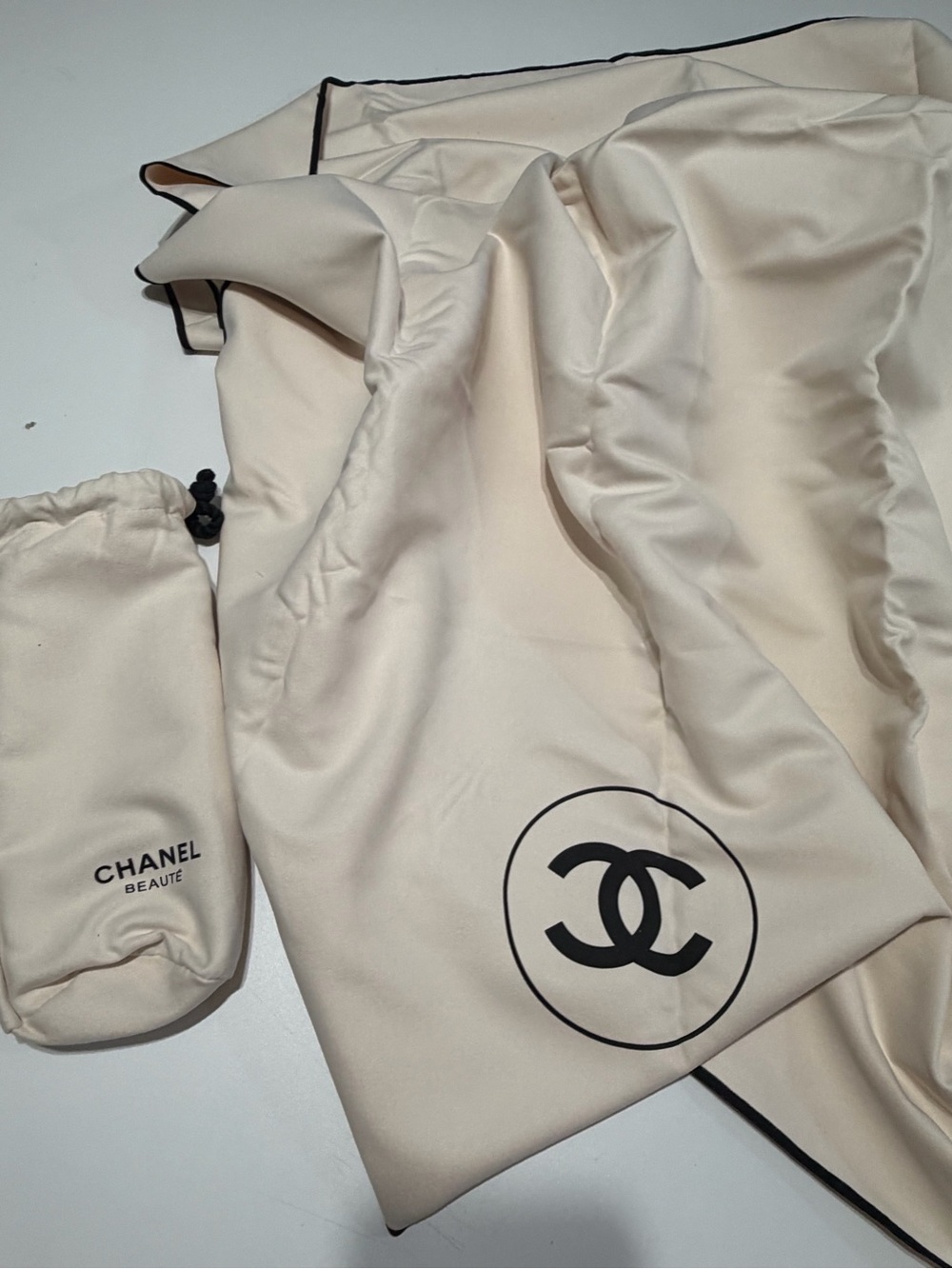 Chanel Cream Satin- towel Cover with Black Logo